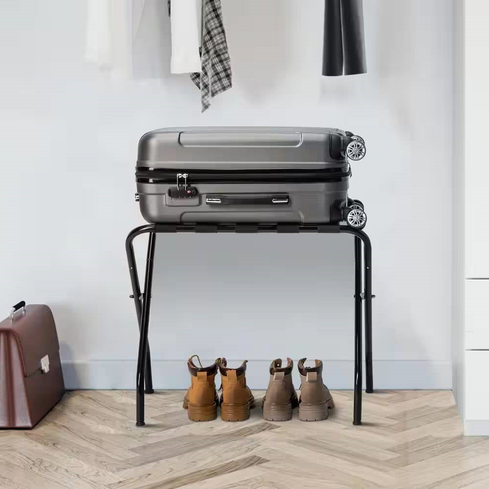 Luggage Racks displaying a suitcase on a stand with shoes below and clothing in the background.
