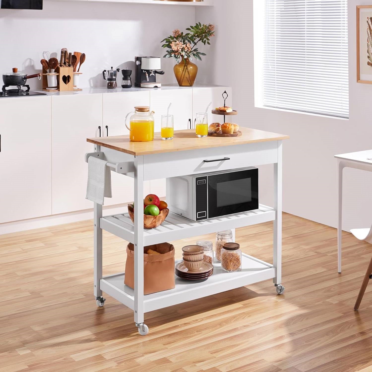 Sunny coastal kitchen with a stylish rolling cart featuring drinks and a microwave, emphasizing a Coastal Kitchen theme.
