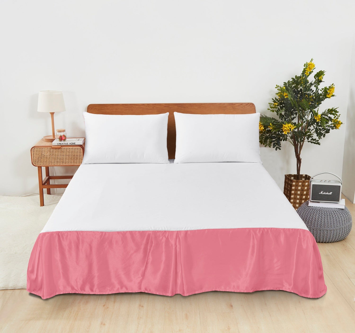 Elegant bed with white sheets and a pink bed skirt from the Bed Skirts and Dust Ruffles collection.