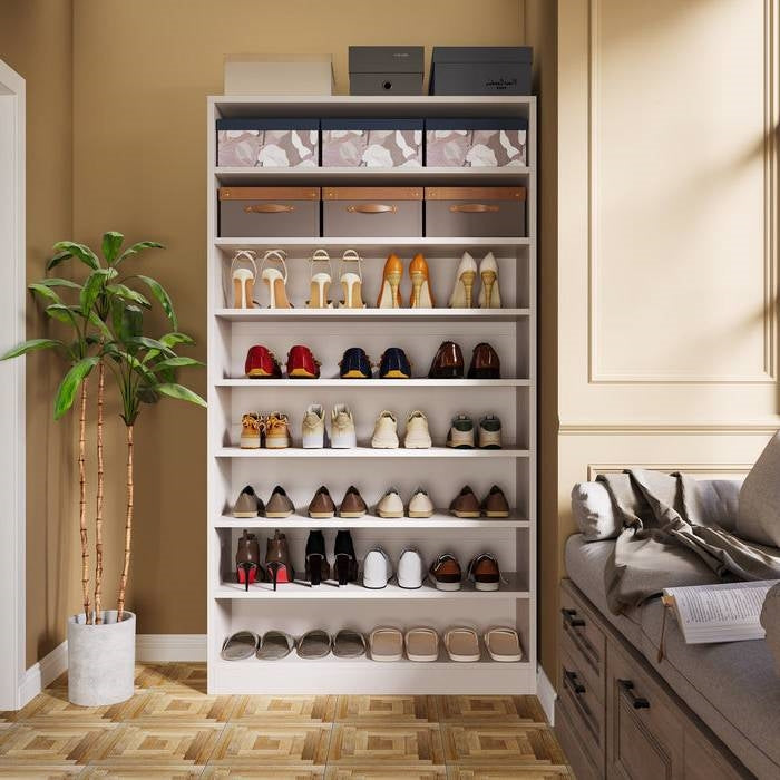 Shoe Storage solution featuring a stylish rack displaying various types of shoes and decorative boxes.