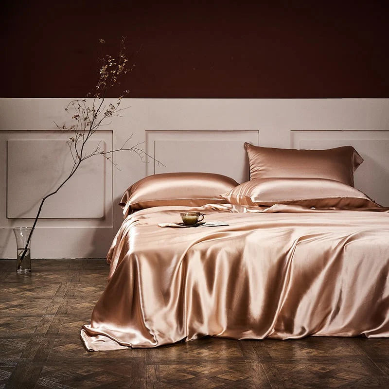 Luxurious Silk Bed Linens spread elegantly on a stylish bed with a minimalist decor.