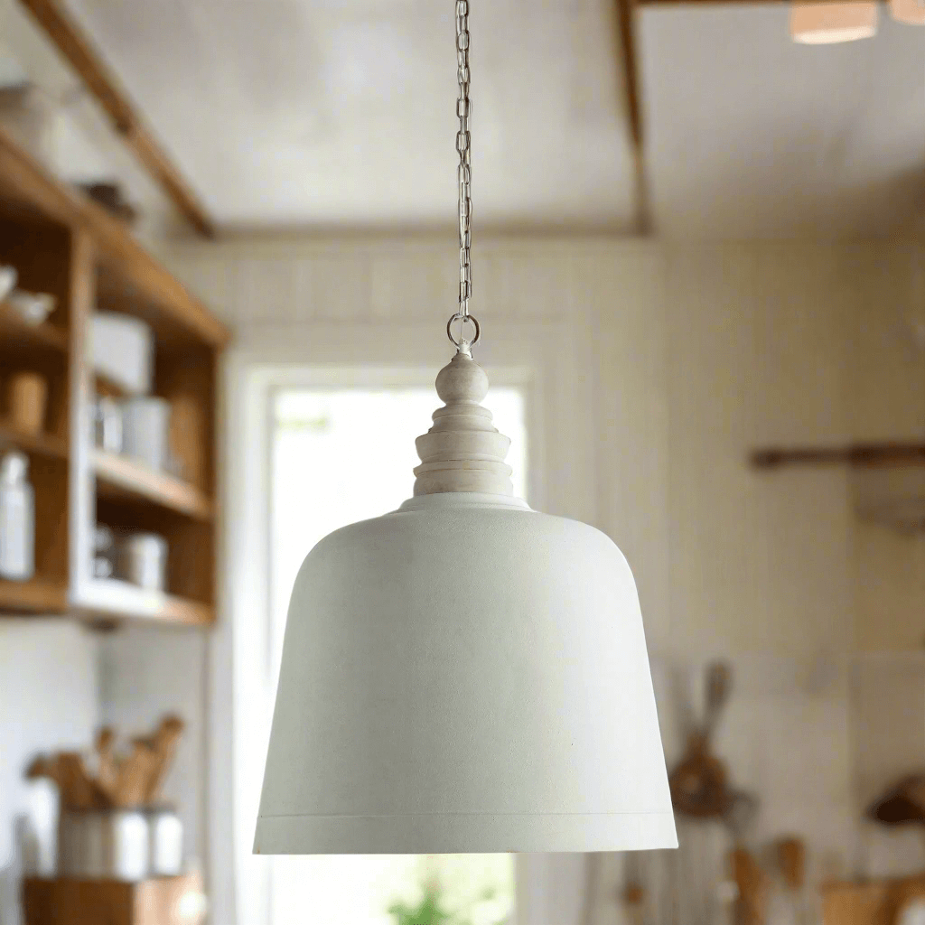 Stylish white pendant light hanging in a kitchen, showcasing elegant pendant lights for modern decor.