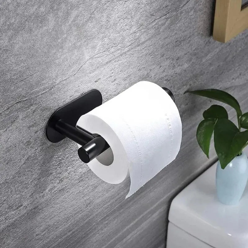 Modern black Toilet Paper Holders mounted on a wall with a roll of toilet paper.