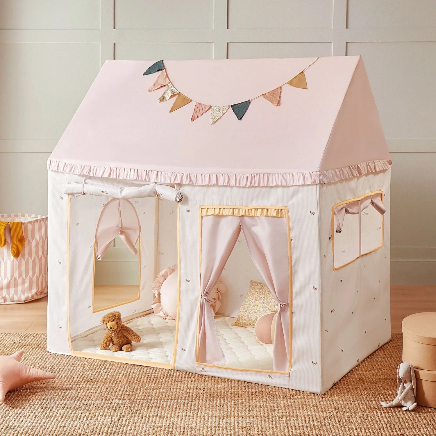 A beautiful pink play tent house decorated with a festive banner, perfect for kids' playtime in the collection: Play Tents and Houses.