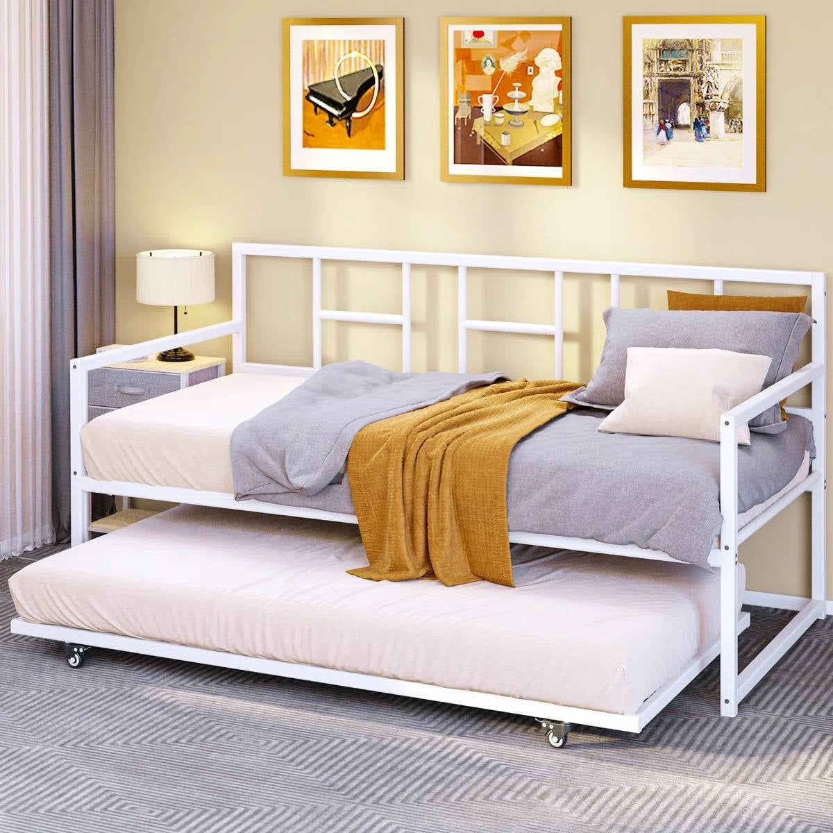 Stylish trundle beds in a modern room featuring a daybed with a pull-out mattress.