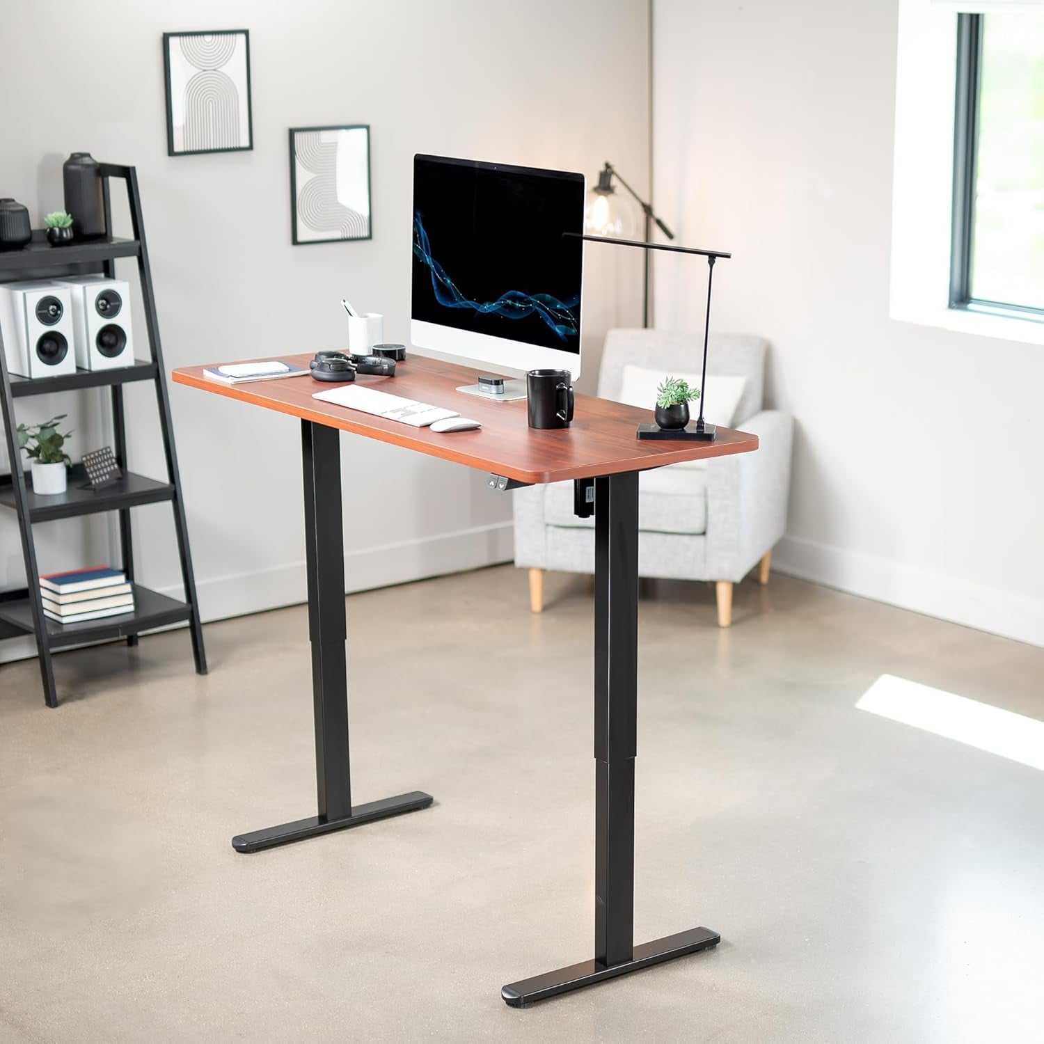 A stylish standing desk with a computer monitor and workspace in a modern office setting.