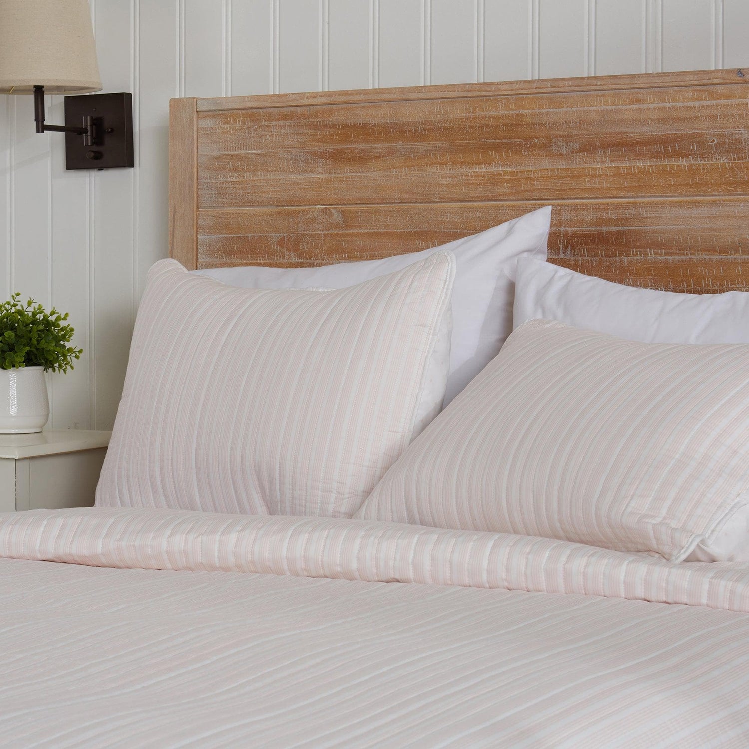 Stylish King and California King Headboards with soft bedding and decorative pillows.