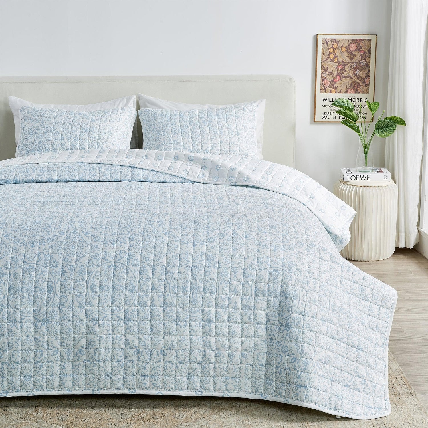 A King and California King Quilts and Comforters set featuring a light blue color and quilted texture.