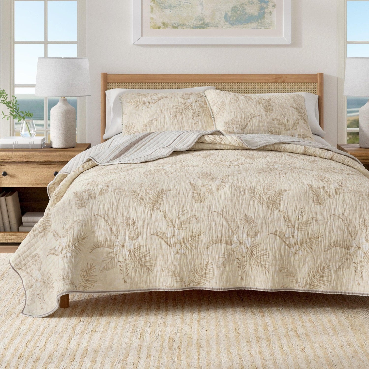 Full and Queen Quilts and Comforters featuring a beautiful floral design on a cozy bed setting.
