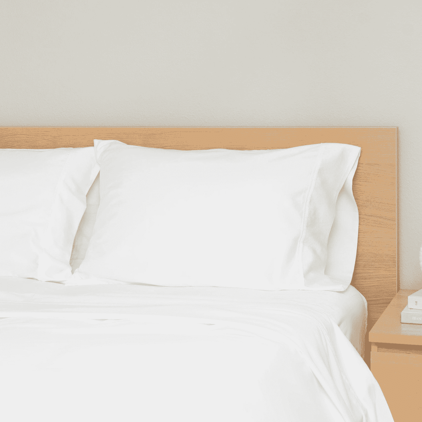 King and California King Bed Sheets on a neatly made bed with white pillows and a light wood headboard.