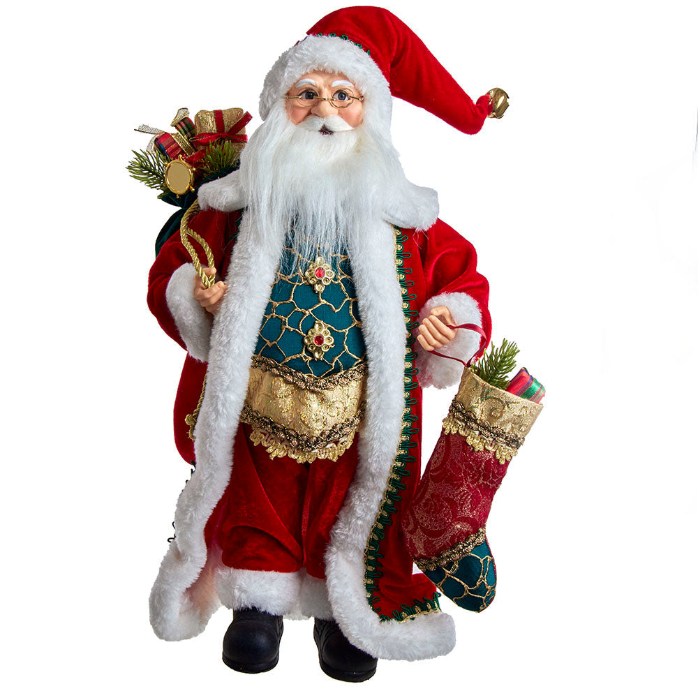 Santa Claus holding a bag and standing with decorative stockings in a festive outfit.