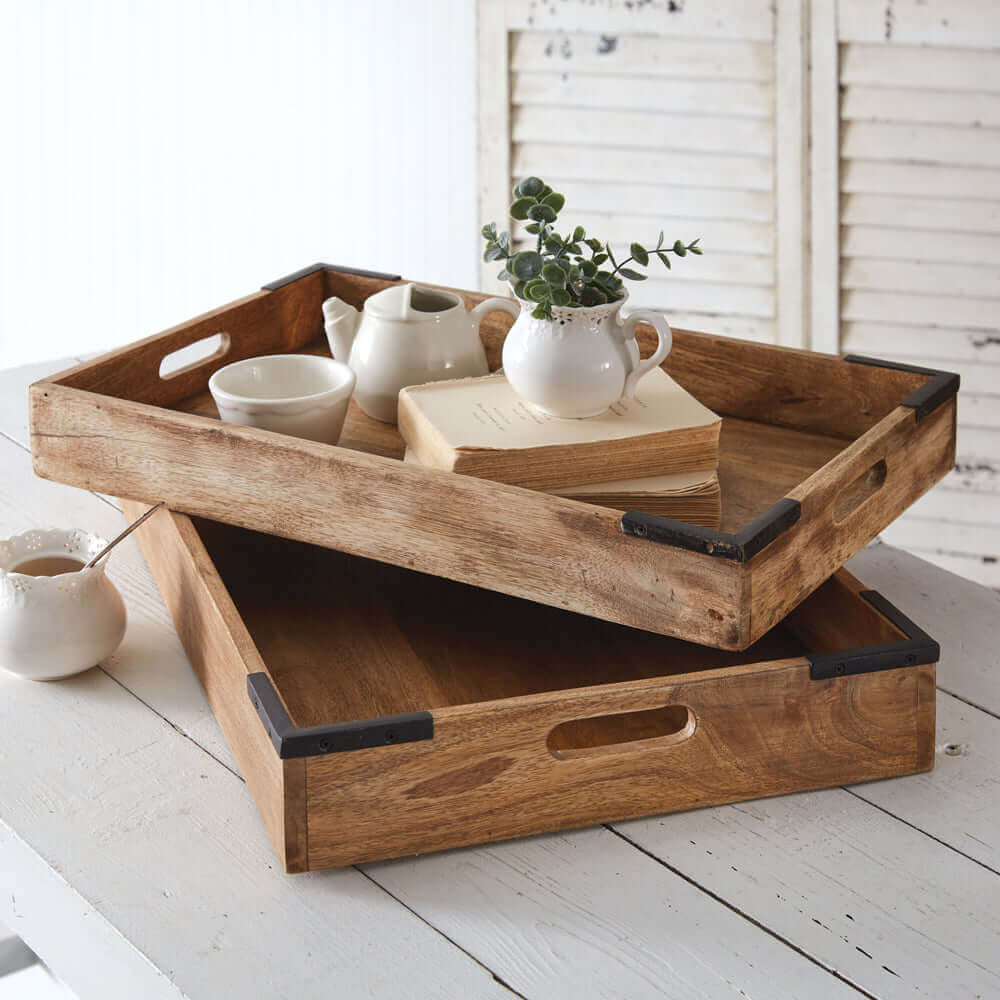 Elegant wooden Serving Trays with handles, displaying a teapot, cups, and a decorative plant on a rustic table.