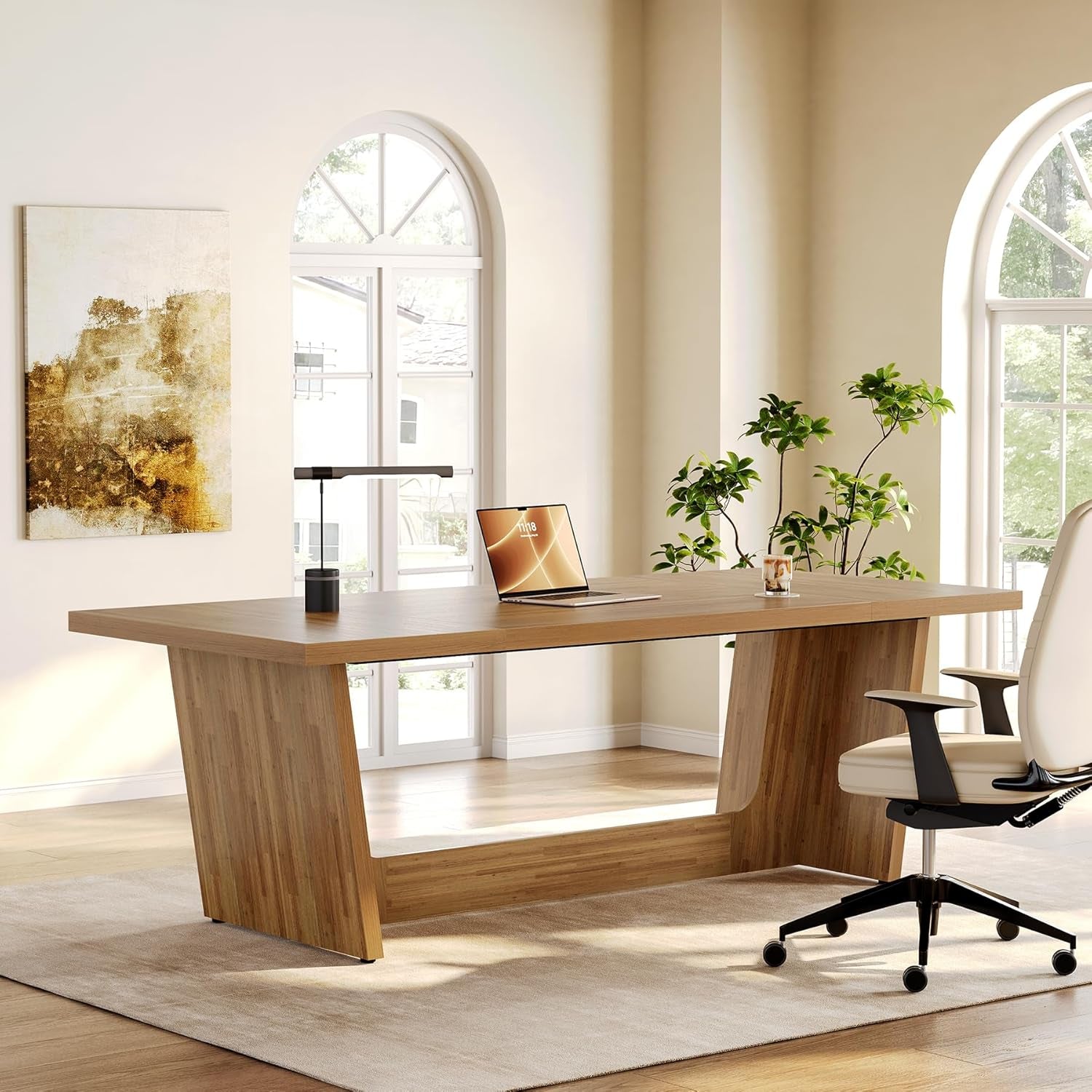 Modern Executive Desks in a bright office setting with large windows and greenery.