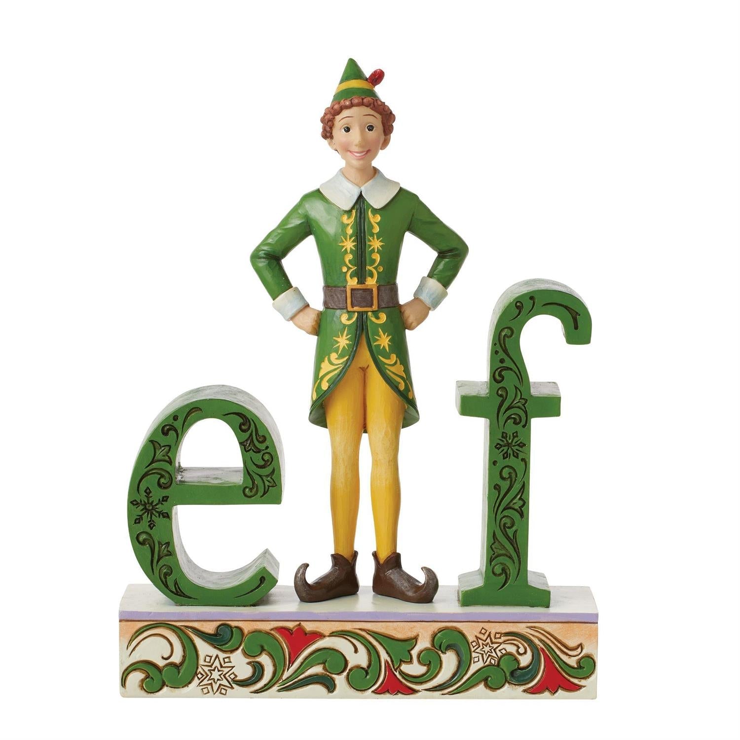 Buddy the Elf figurine standing next to the letters e and f, celebrating the holiday spirit.