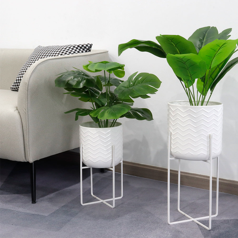 Set of 2 Planters With Stand 17&12 Tall Flower Pots Bright White displaying leaf plants in stylish stands.
