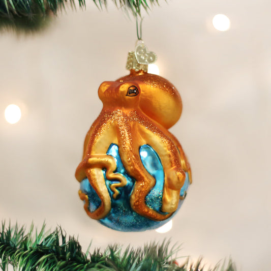 Decorative octopus ornament hanging on a Christmas tree.