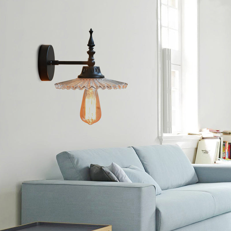 Light Up Your Space with Industrial Chic: The 1-Light Black Sconce with Clear/Green Glass