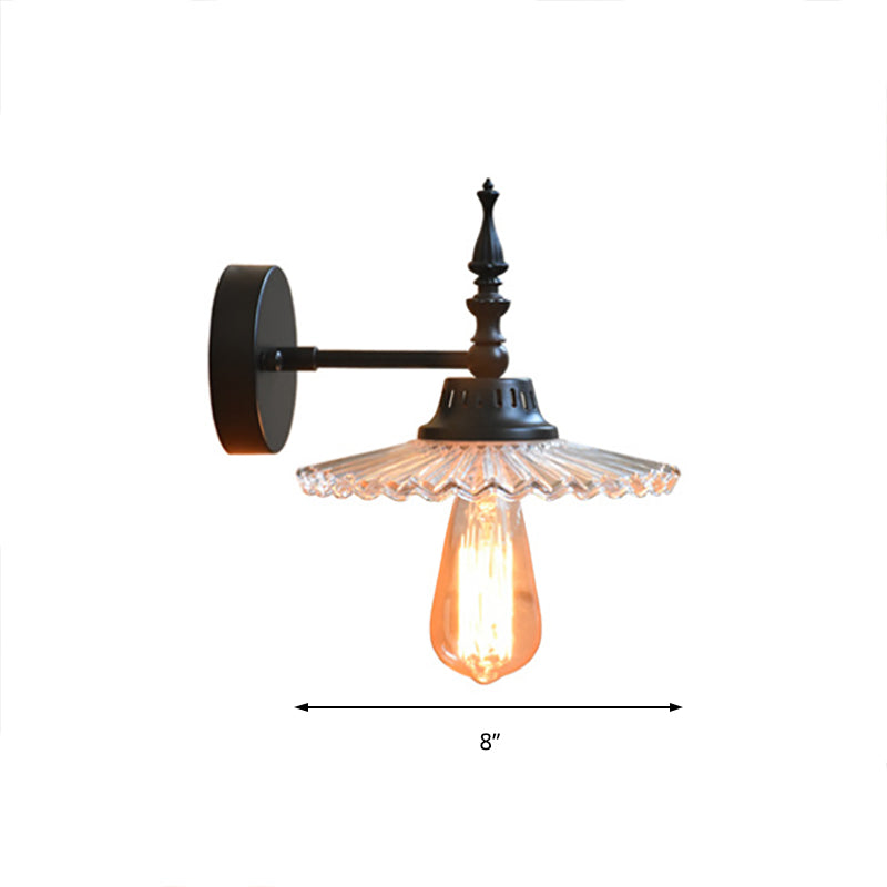 Light Up Your Space with Industrial Chic: The 1-Light Black Sconce with Clear/Green Glass