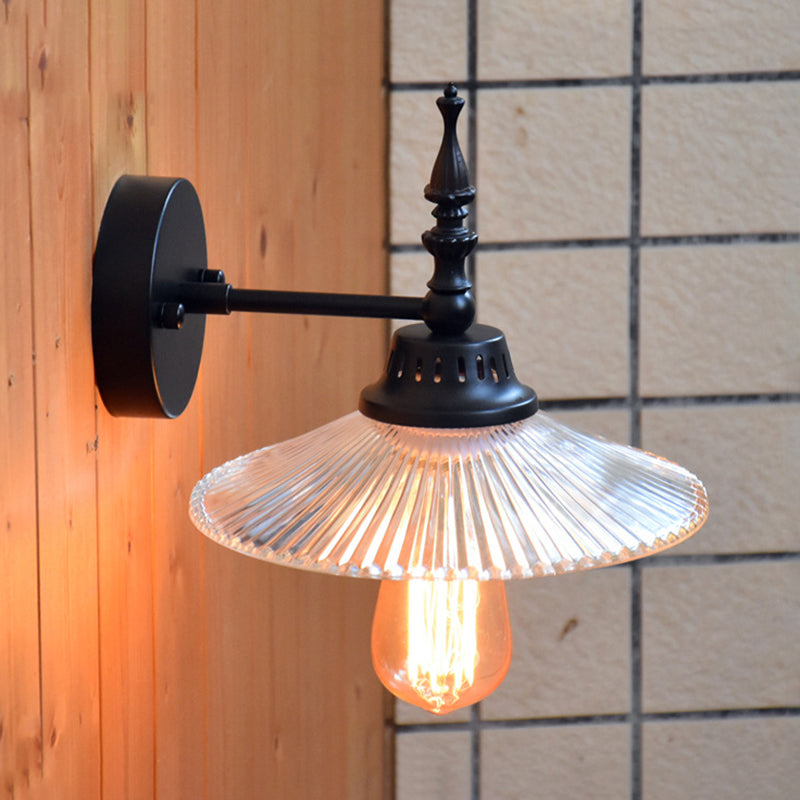 Light Up Your Space with Industrial Chic: The 1-Light Black Sconce with Clear/Green Glass