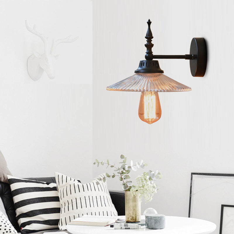 Light Up Your Space with Industrial Chic: The 1-Light Black Sconce with Clear/Green Glass