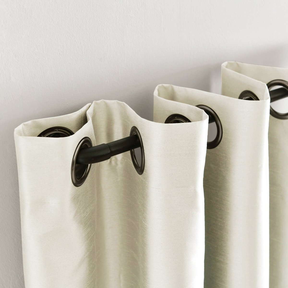 Close-up of Faux Silk 100% Blackout Window Curtain with grommet details, showcasing luxury and modern design.