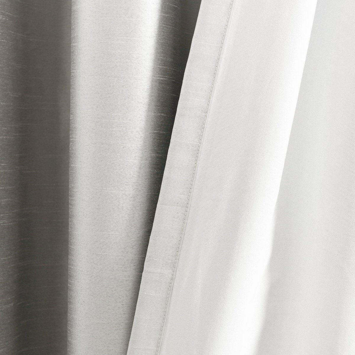 Faux Silk 100% Blackout Window Curtain in luxurious smooth fabric for complete privacy.