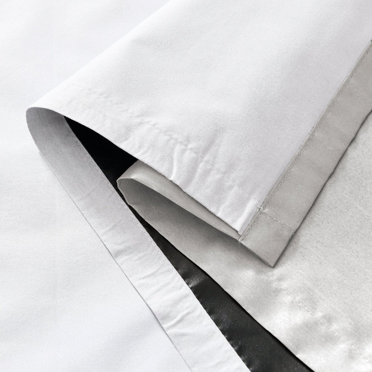 Close-up of Faux Silk 100% Blackout Window Curtain showing smooth texture and true blackout lining.