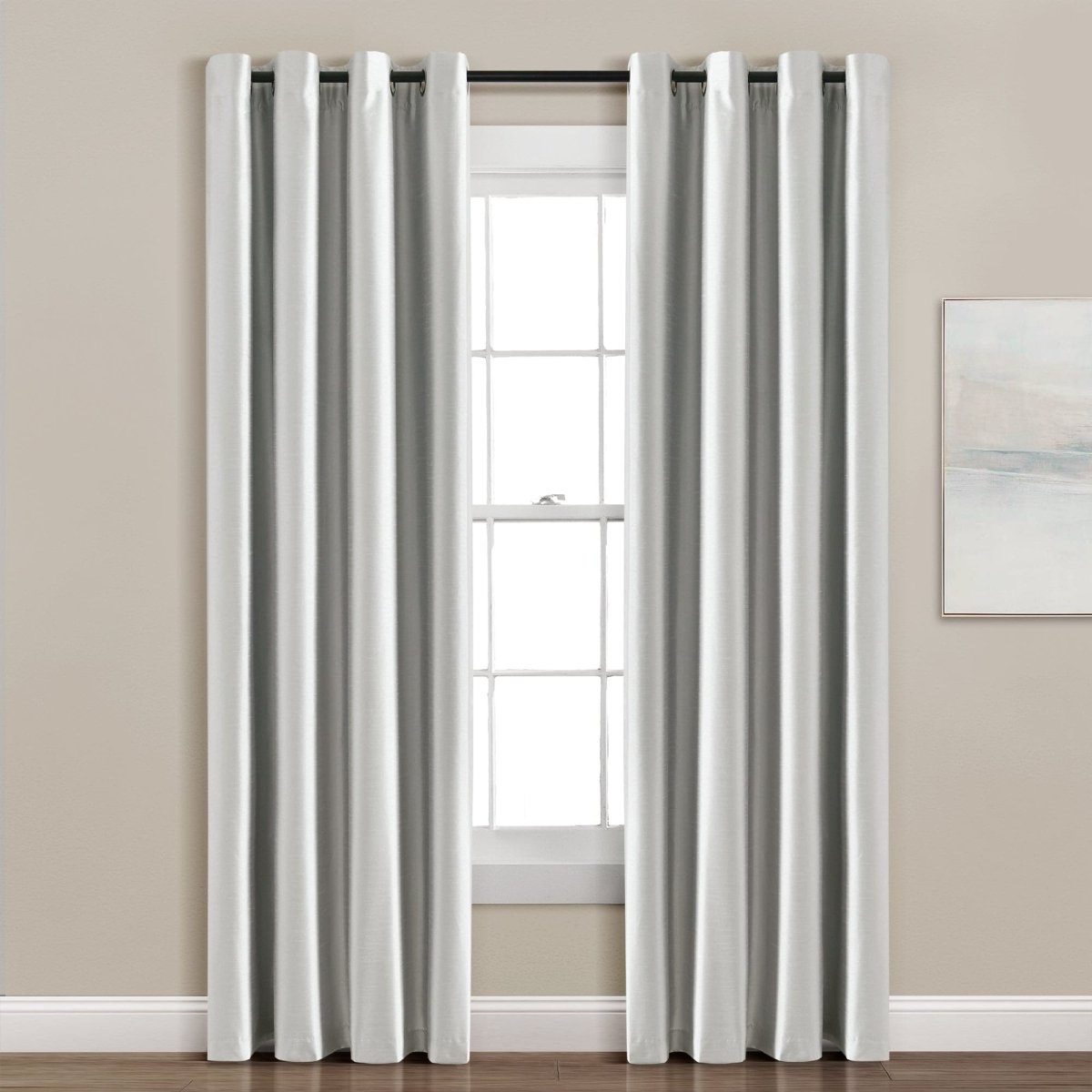 Faux Silk 100% Blackout Window Curtain panel hanging in a window, providing complete privacy and a modern design.