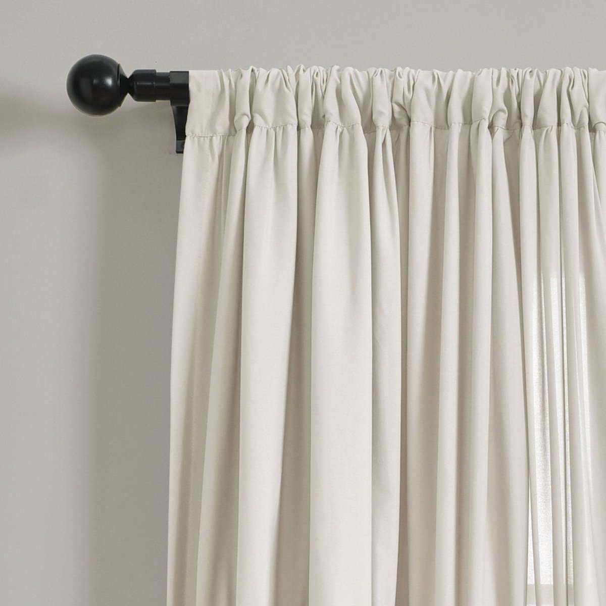 Darla Window Curtain single panel featuring soft, pleated fabric hung on a modern curtain rod.