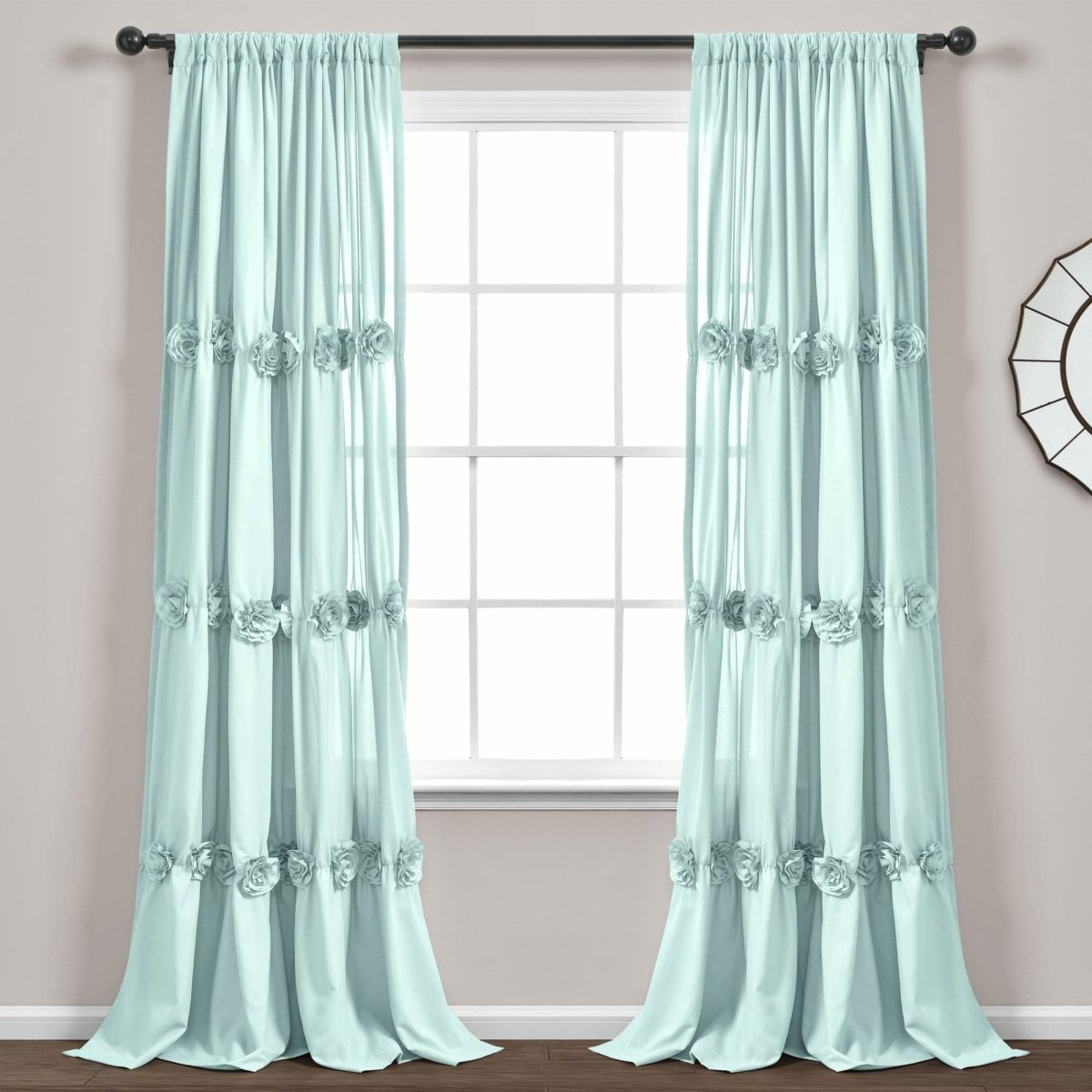 Darla Window Curtain in soft blue, featuring handcrafted flower embellishments, enhancing windows with style and elegance.