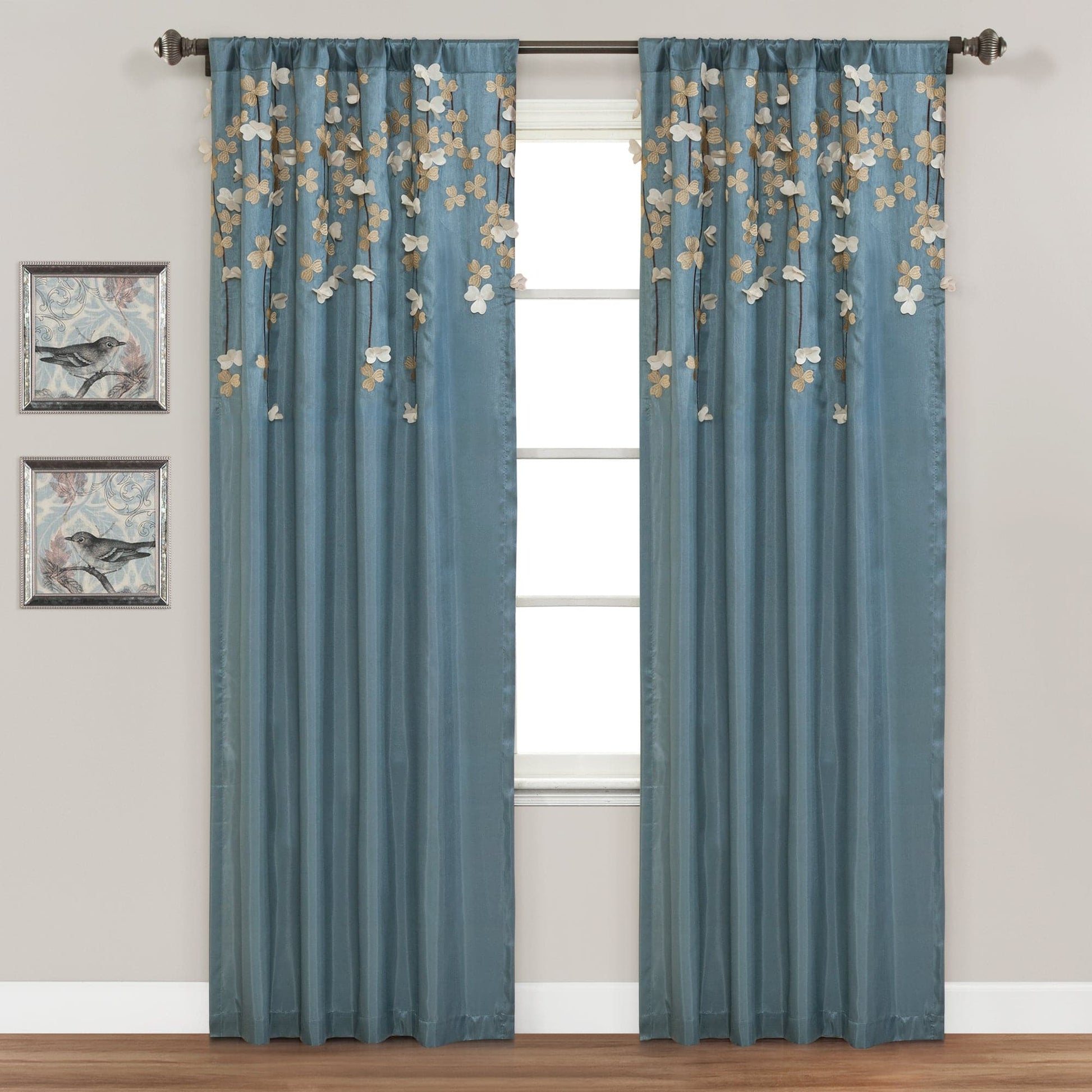 Flower Drops Window Curtain in soft blue with floral embroidery, adding artistic texture to a room.