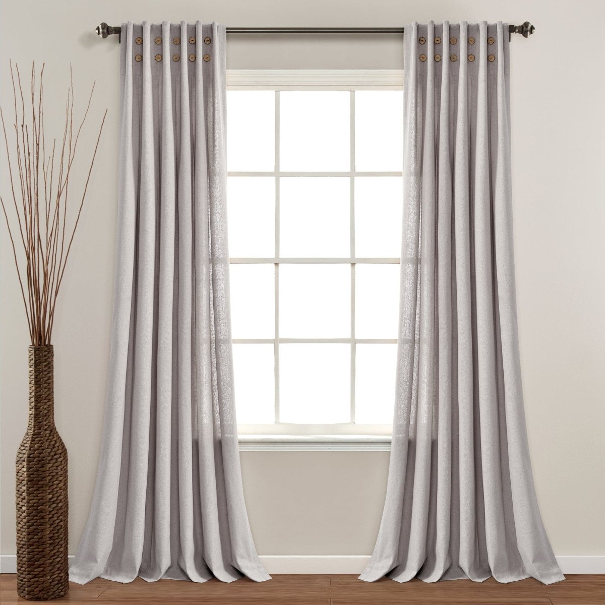 Linen Button Pinched Pleat Window Curtain hanging elegantly in a well-lit room with a decorative vase.