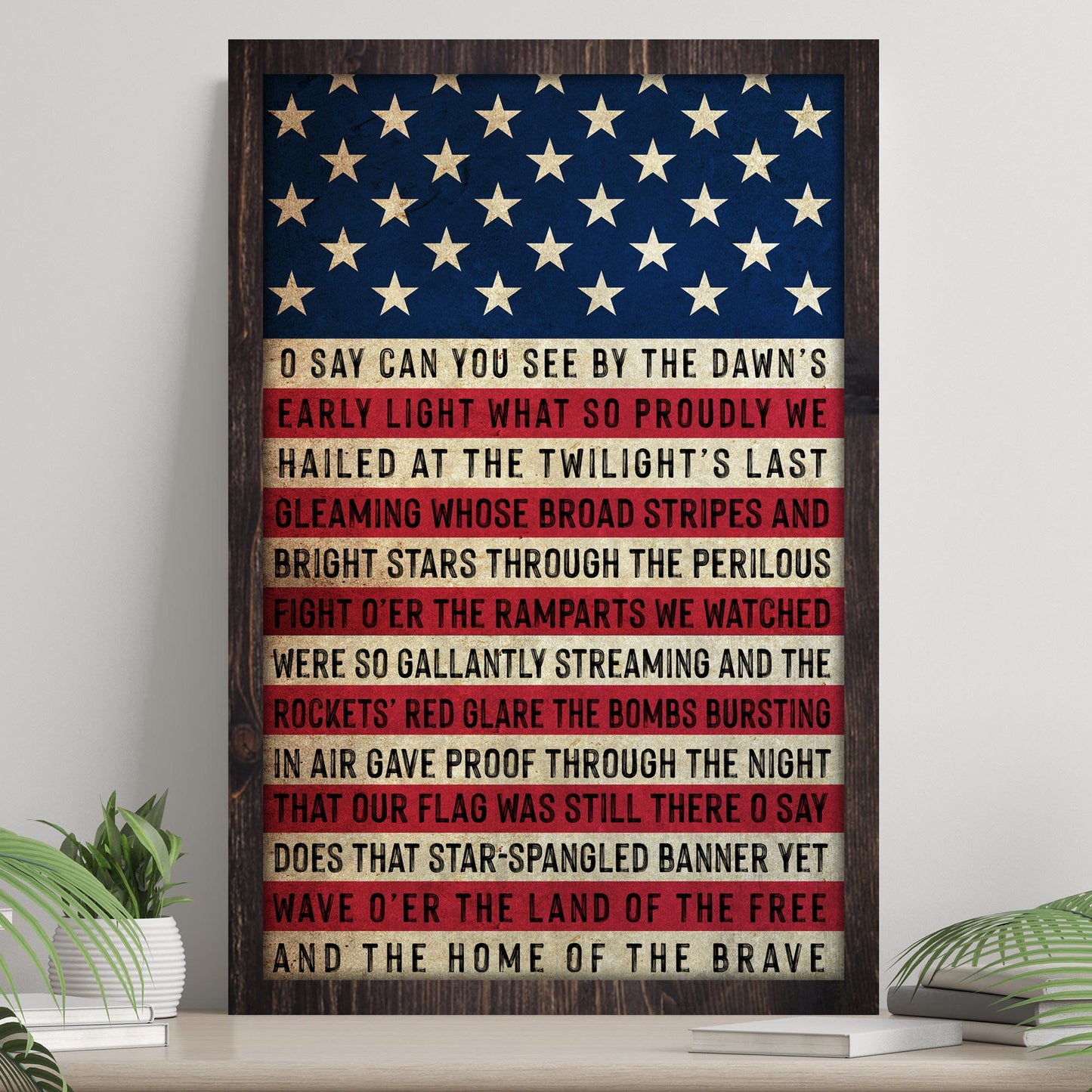 Framed American flag with text on a wooden surface
