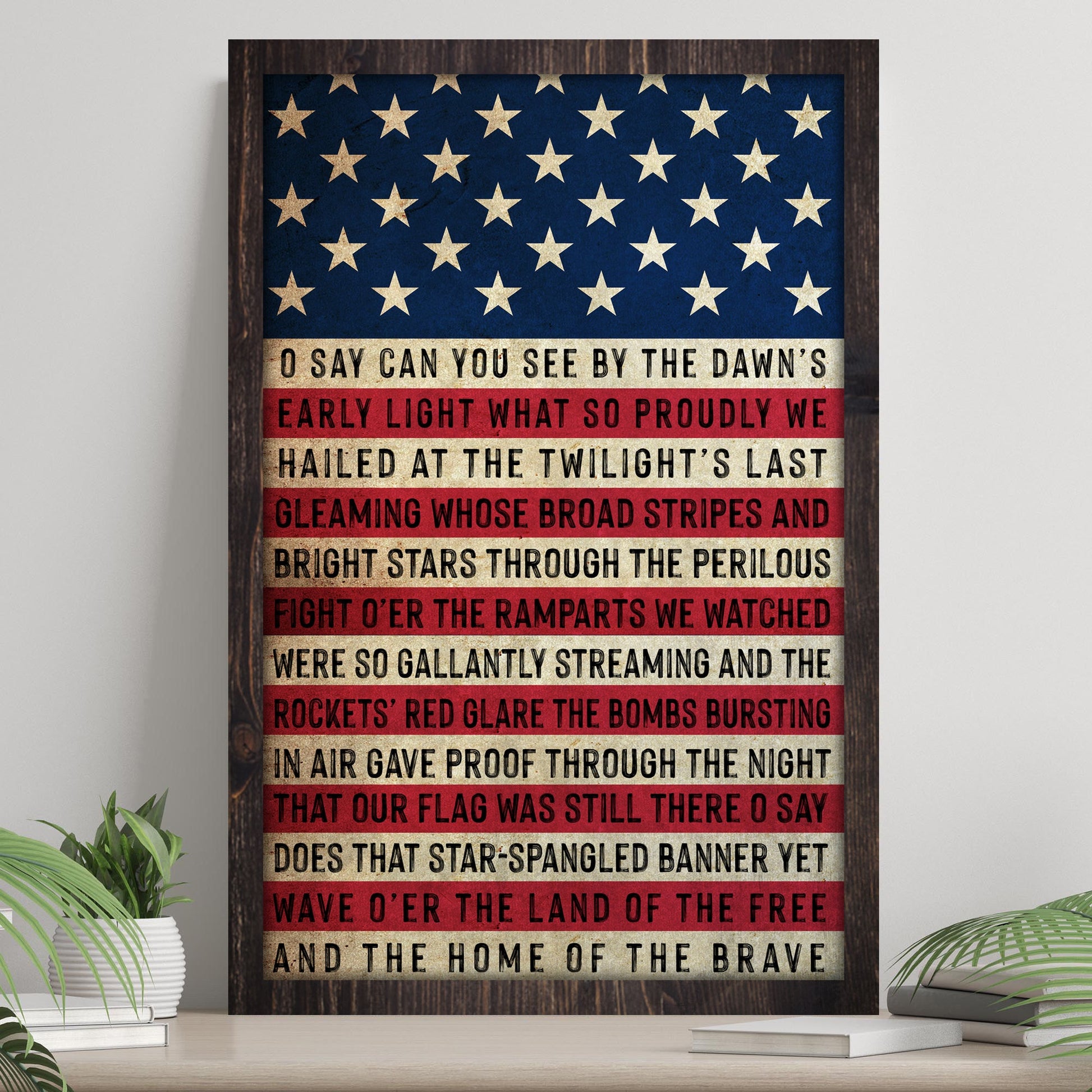 Framed American flag with text on a wooden surface