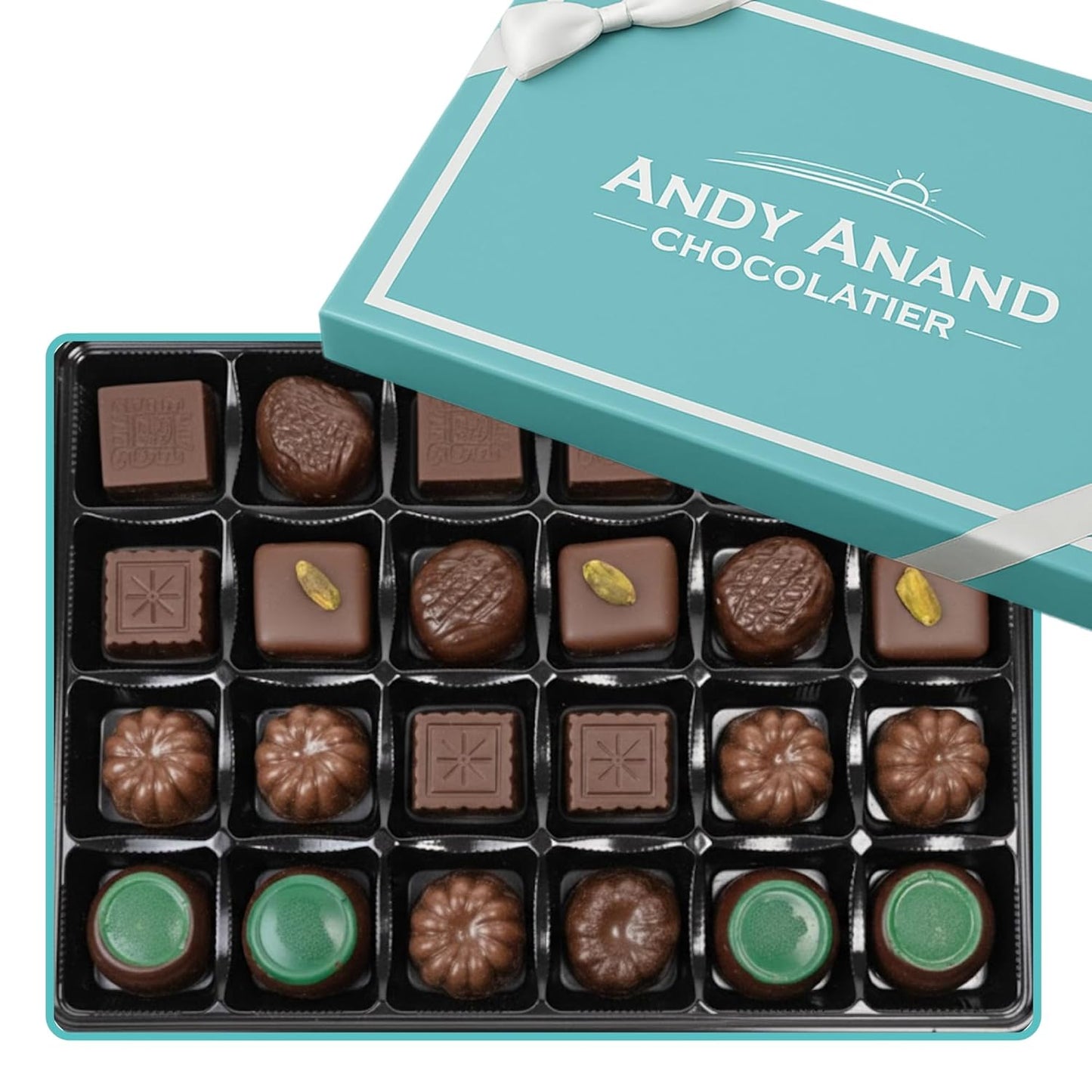 Assorted chocolates in a box with 'Andy Anand Chocolatier' branding.