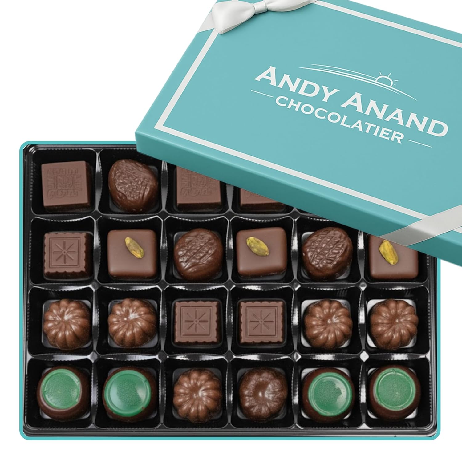 Assorted chocolates in a box with 'Andy Anand Chocolatier' branding.