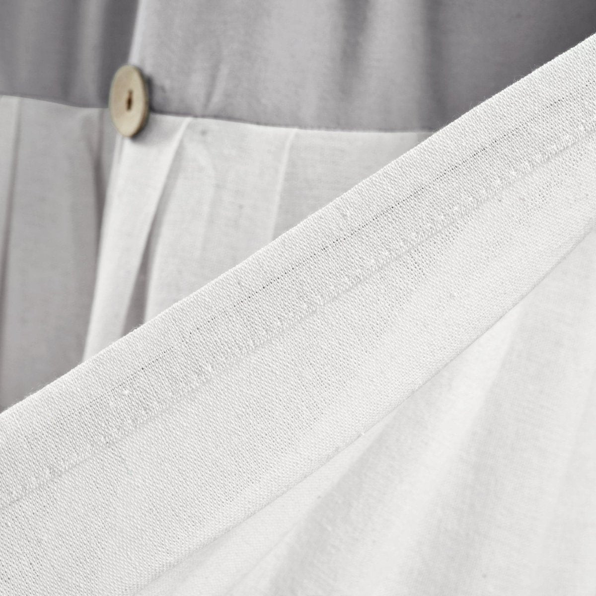 Close-up of the Linen Button Valance showcasing pleats and wooden button details.