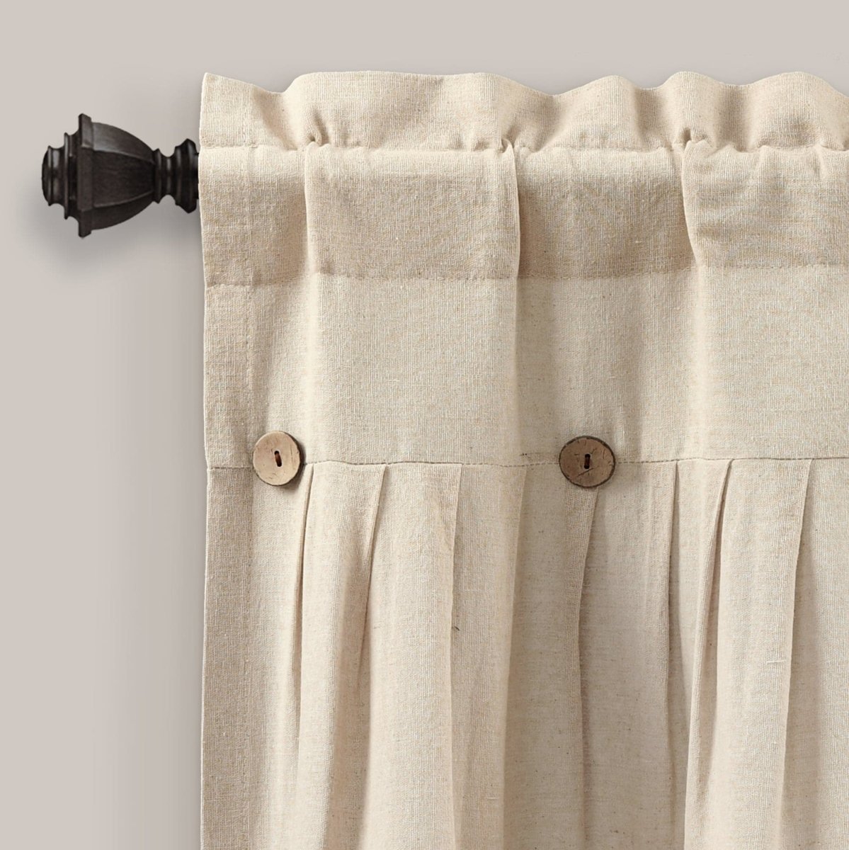 Linen Button Valance featuring pleats and wooden buttons hanging on a curtain rod.