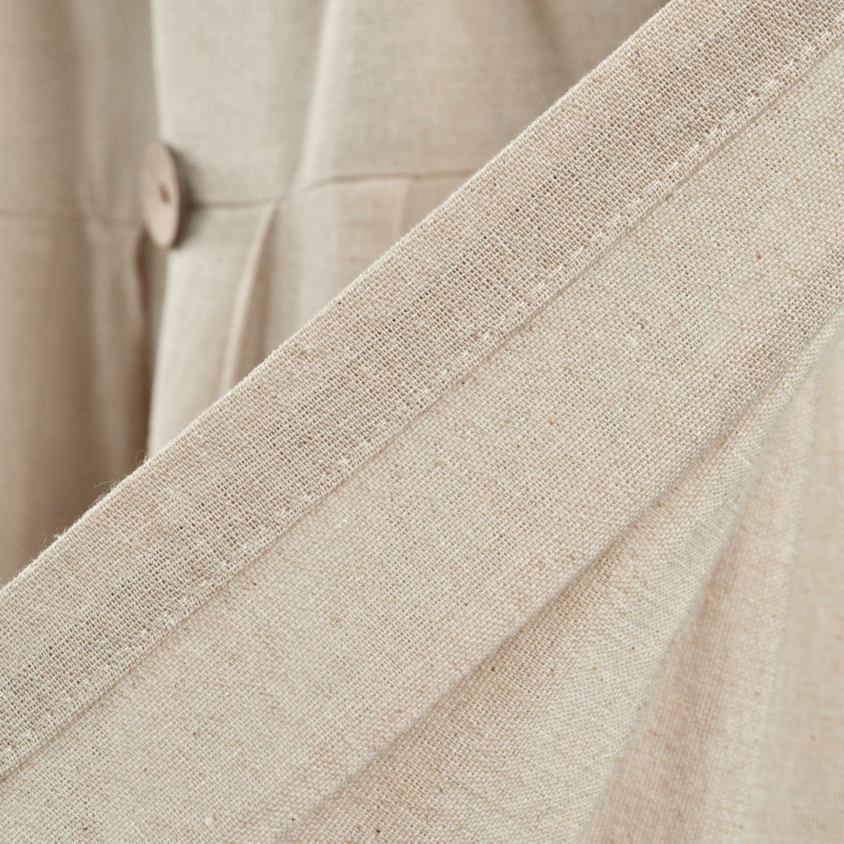 Close-up of the Linen Button Valance showcasing pleats and natural fiber texture.