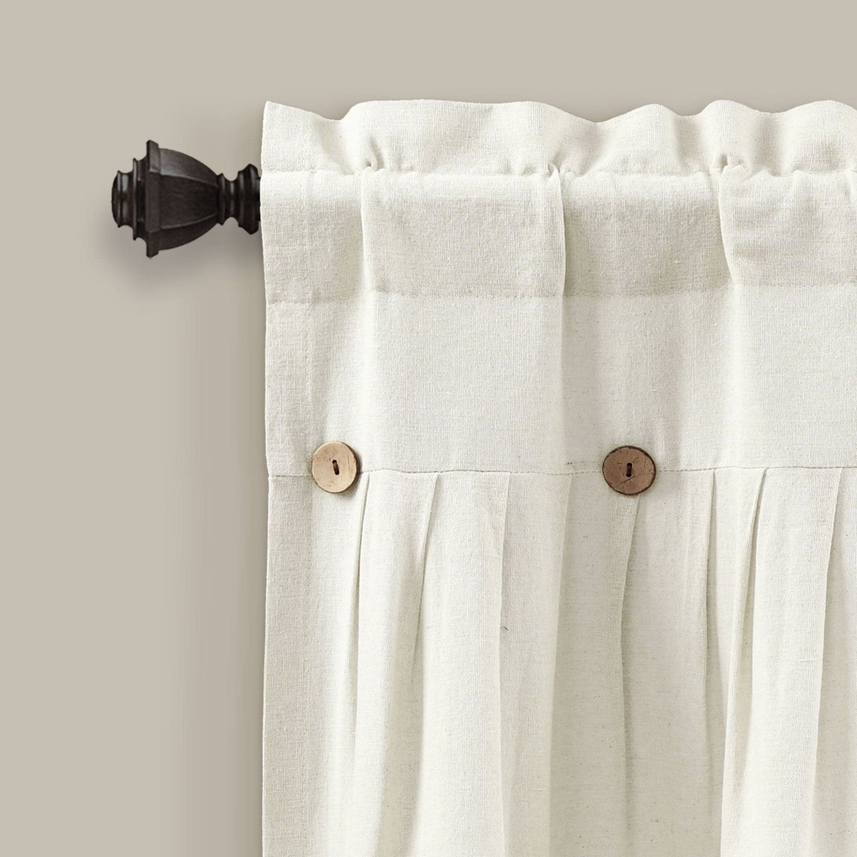 Close-up of Linen Button Valance with pleats and wooden buttons on a curtain rod.