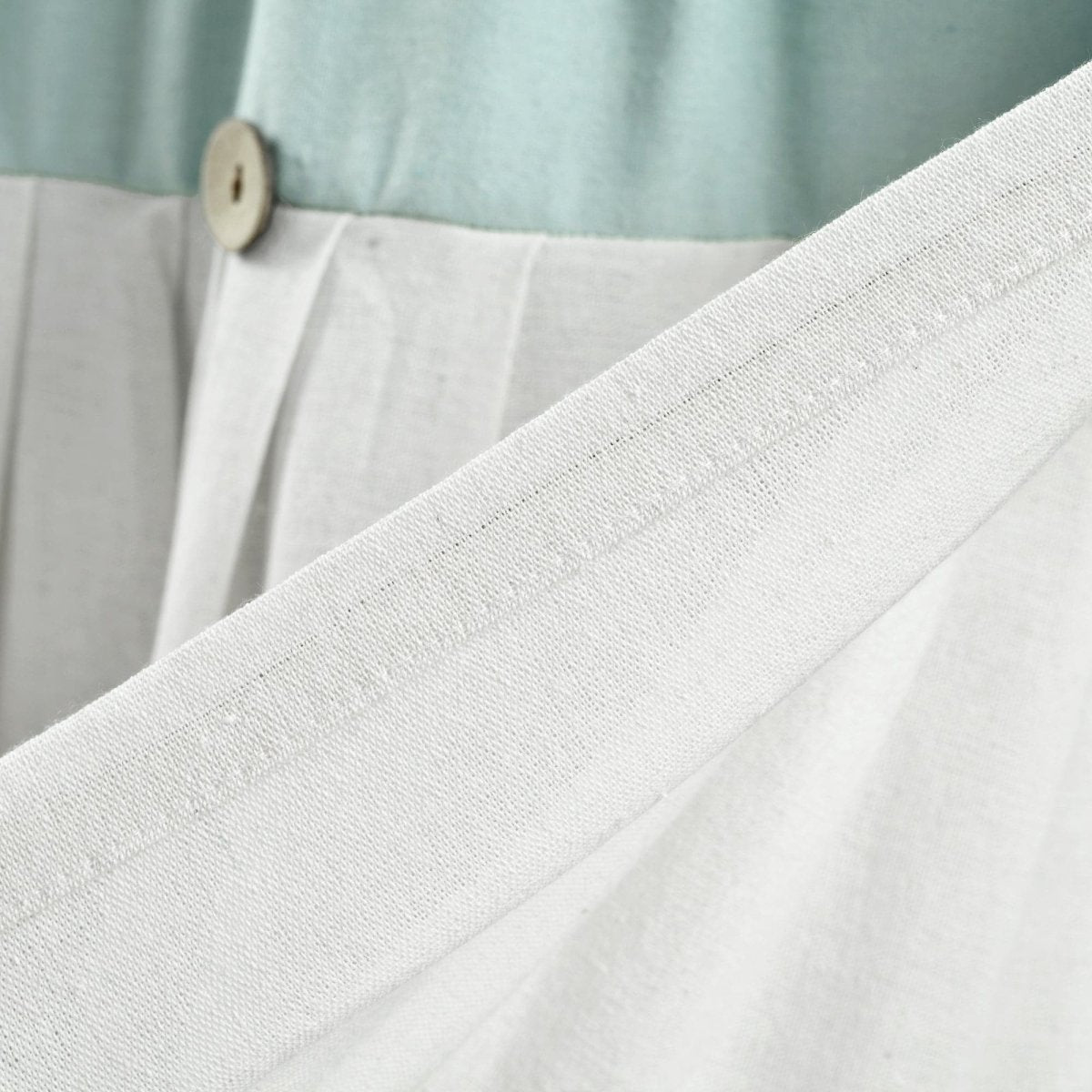 Linen Button Valance featuring pleats and buttons, showcasing elegant color blocking and natural fiber detail.