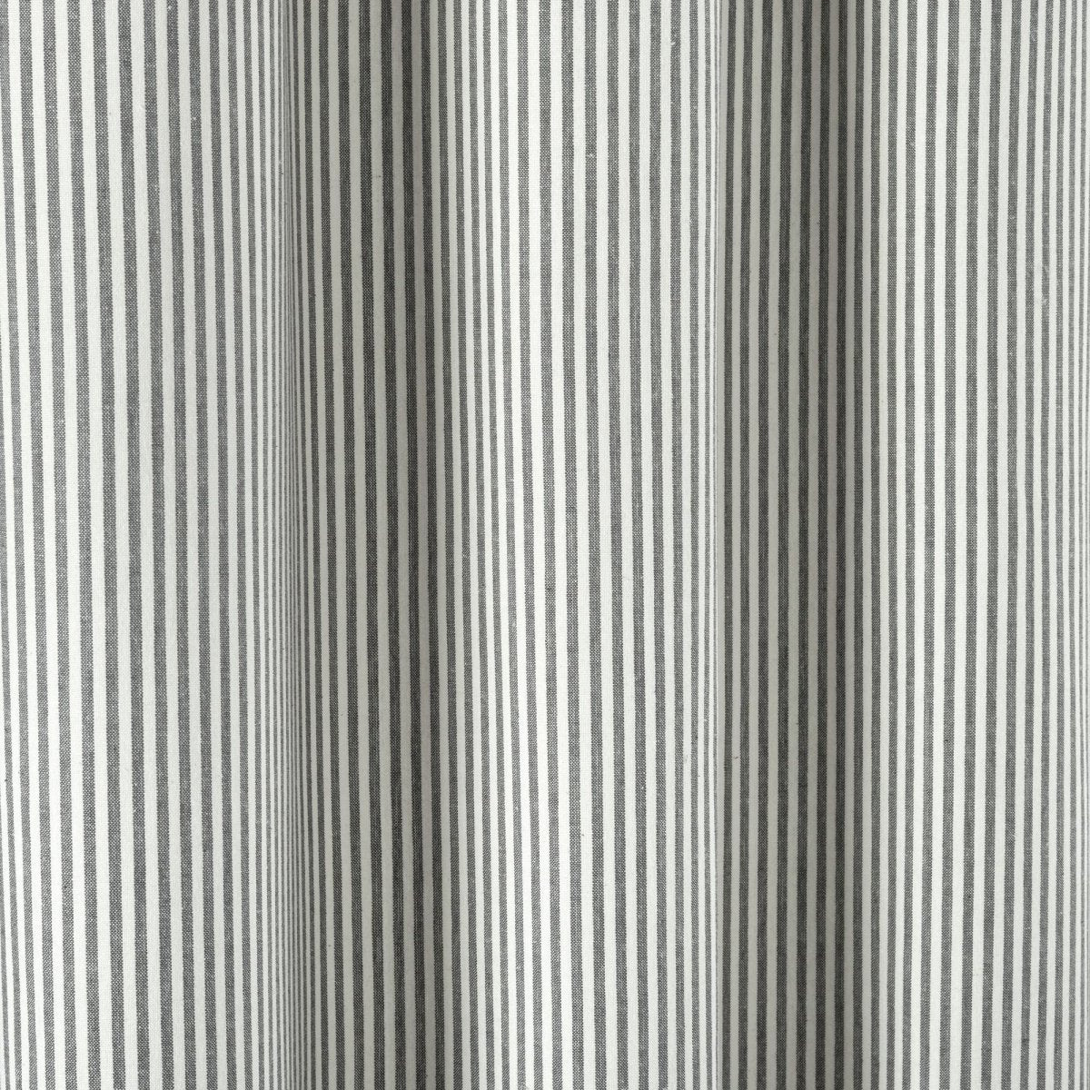 Close-up of farmhouse vintage stripe yarn dyed recycled cotton blend shower curtain in a soft gray and white pattern.