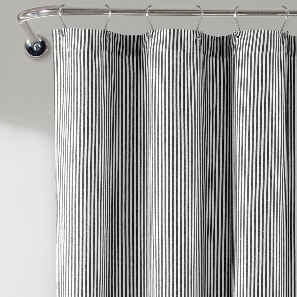 Farmhouse Vintage Stripe Yarn Dyed Recycled Cotton Blend Shower Curtain hanging in a bathroom.