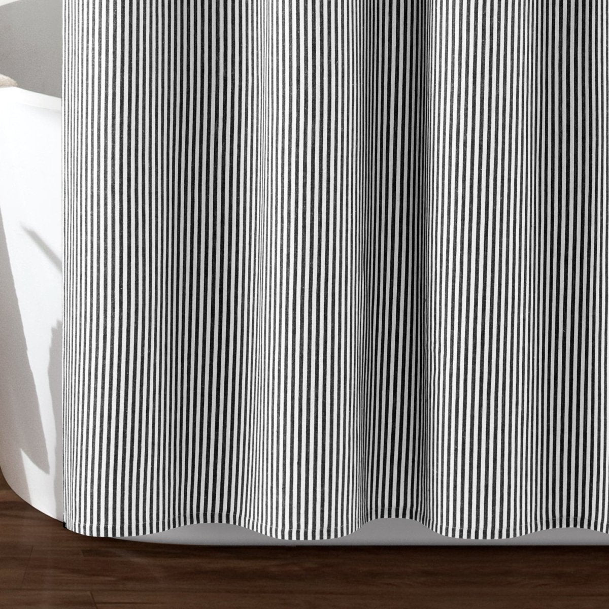 Close-up of Farmhouse Vintage Stripe Yarn Dyed Recycled Cotton Blend Shower Curtain with black and white stripes.