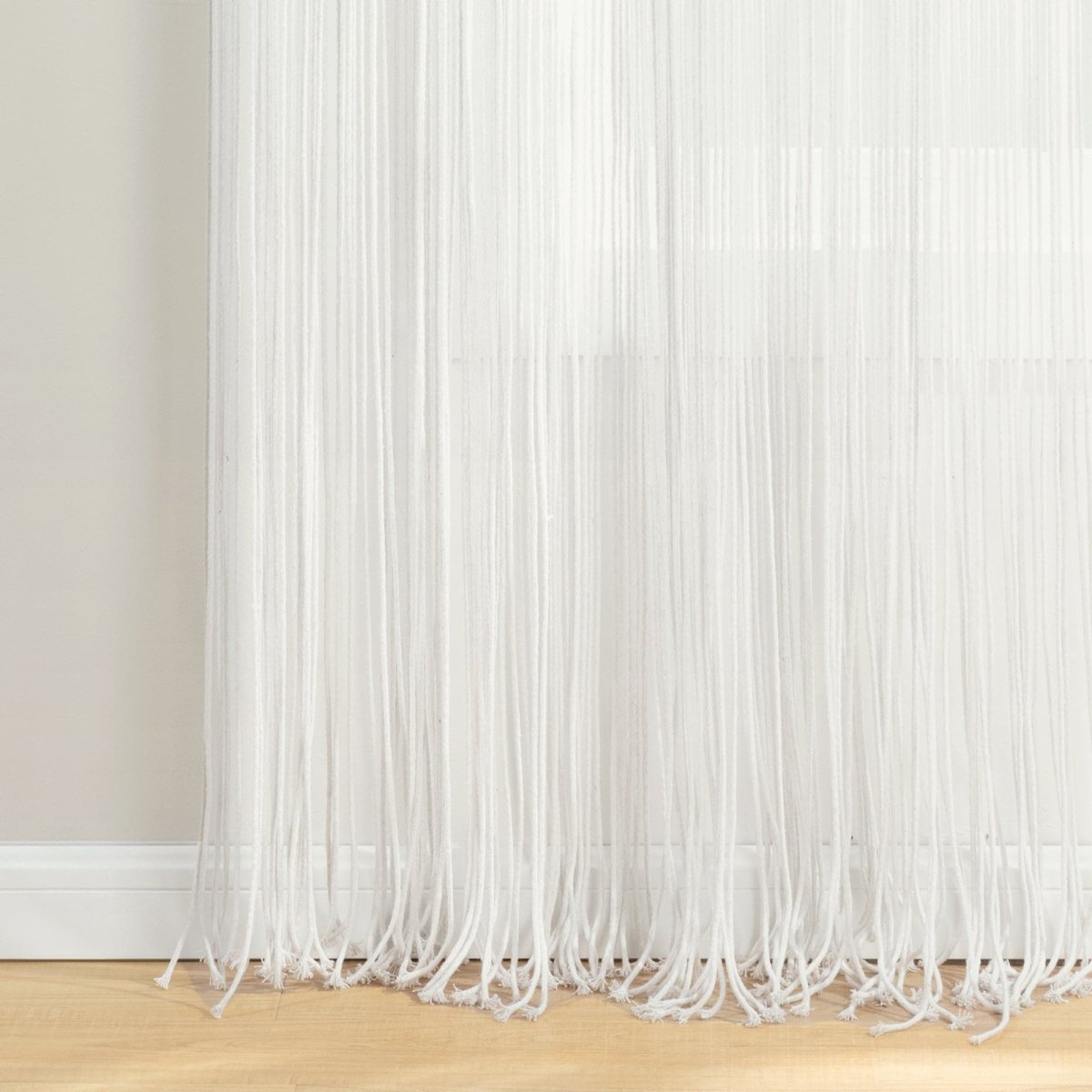 Boho Macrame Leaf Cotton Window Curtain with flowy fringe and intricate knots filtering natural light.