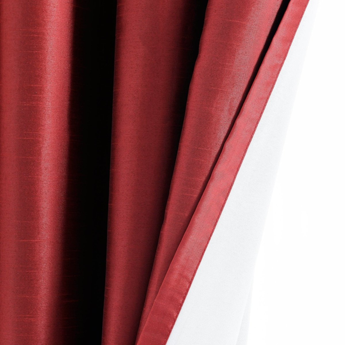 Close-up of a Faux Silk 100% Blackout Window Curtain, showcasing rich red fabric and smooth texture, ideal for elegant interiors.