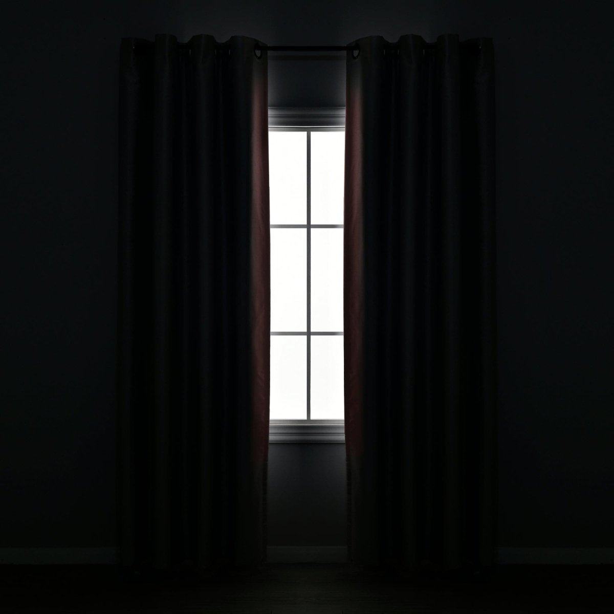 Blackout Window Curtain covering a window, providing complete privacy and a luxurious look in a dark room.