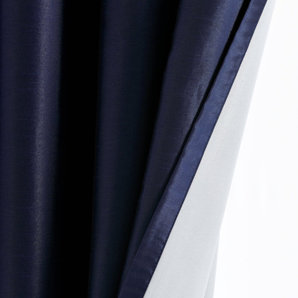 Faux Silk 100% Blackout Window Curtain showcasing luxurious fabric and true blackout lining.