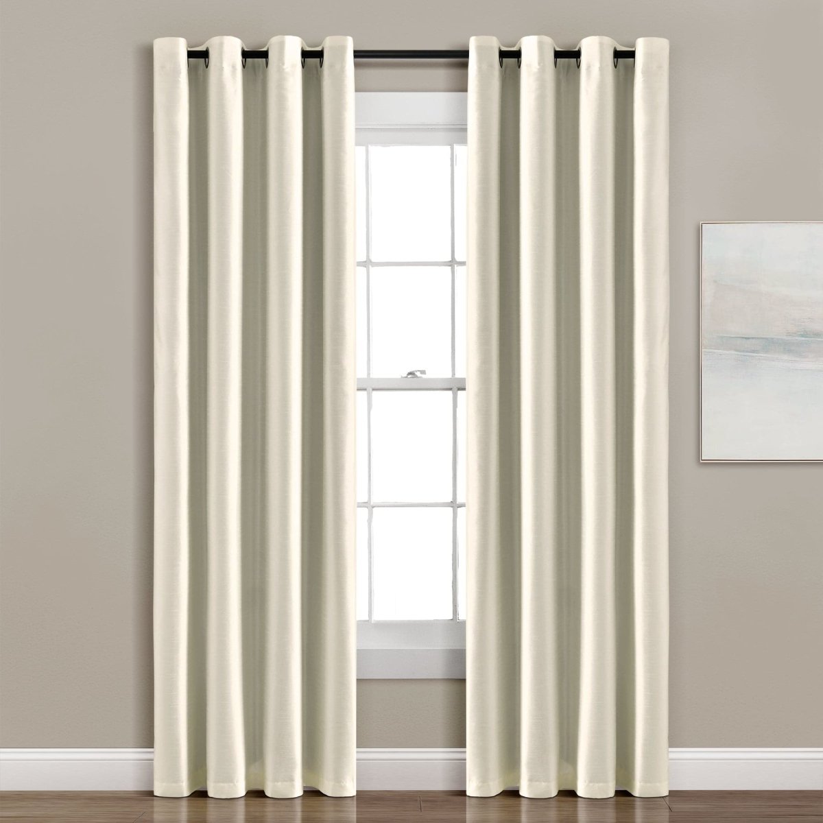 Elegant cream Faux Silk 100% Blackout Window Curtain enhancing privacy in a modern living space.