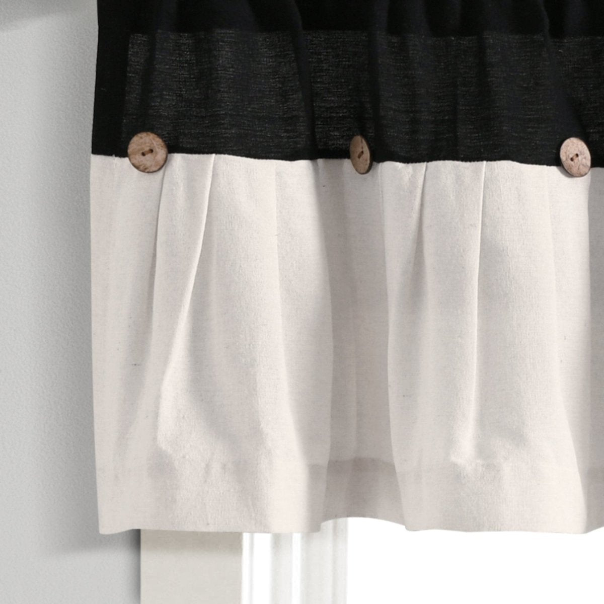 Linen Button Valance featuring pleats and wooden buttons, showcasing a stylish black and cream color block design.
